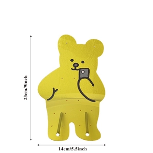 Detailed view of yellow bear wall hook organizer with dimensions 23x14cm for jewelry