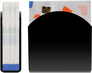 U-shaped black acrylic cocktail napkin holder with polka dot tissue on white background