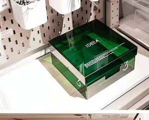 Detail showing Nordic emerald green acrylic storage box with clear base and lid lettering