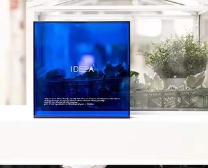 Detail of blue acrylic storage tray with white IDEA text in a bright modern interior