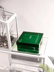 Detail of dark green translucent acrylic storage box with NO. 3 and IDEA print