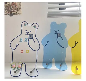 Detail of bear-shaped acrylic jewelry stands for earrings and necklaces display