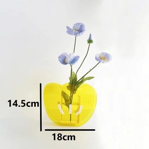 Detail showing height 14.5cm and width 18cm of yellow acrylic heart-shaped vase