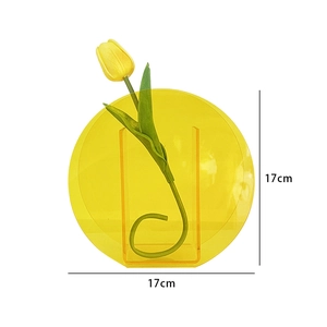 Modern yellow acrylic vase with circular geometry and rectangular flower holder detail