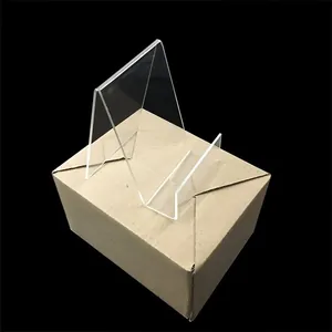 Detailed view of clear acrylic book display stand with stable triangular support structure