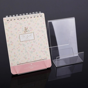 Close-up of clear acrylic display stand with L-shape design for books and albums