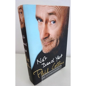 Close-up of a clear acrylic book stand supporting an autobiography book on white background