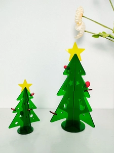 Modern acrylic Christmas tree ornaments with translucent green panels and yellow stars
