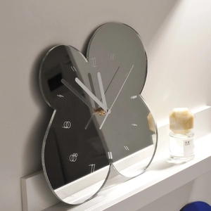 Modern minimalist silver mirror wall clock with petal-shaped design and silent movement