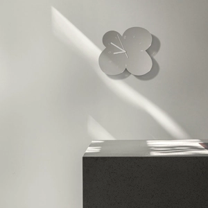 Minimalist silver flower shaped wall clock with metal finish and silent movement