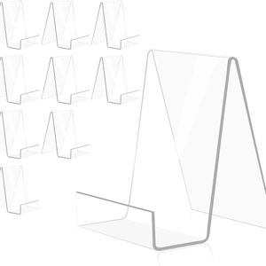 Minimalist clear acrylic display stands for books and frames with tilted support design