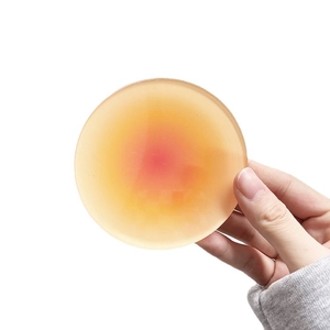 Round silicone nipple covers with natural sunset gradient skin tone for breast protection