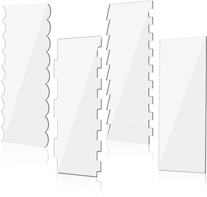 Macro view of four clear acrylic cake scrapers showing various serrated edge patterns