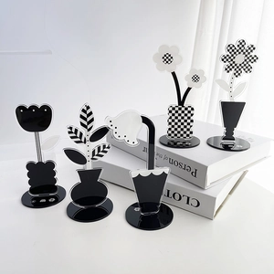 Detailed set of five black and white acrylic flower desktop ornaments with checkerboard patterns