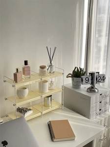 Three-tier cream yellow acrylic makeup organizer shelf for desktop perfume storage