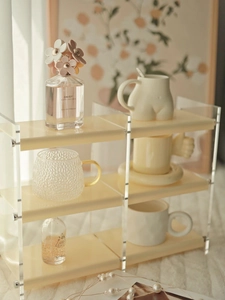 Close-up of double-layer cream acrylic vanity shelf for perfume and cosmetics display