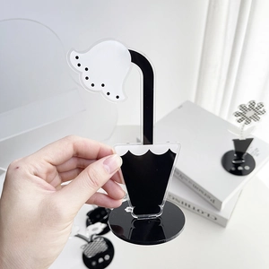 Portafoto a fiore in acrilico bianco e nero minimalista con supporto tondo