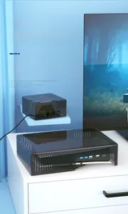 Detailed view of the dark gray acrylic dust cover with cooling vents for game consoles