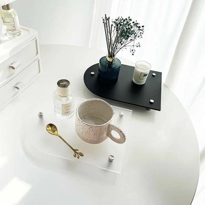 Irregular acrylic coffee tray set in clear and black colors with silver metal feet