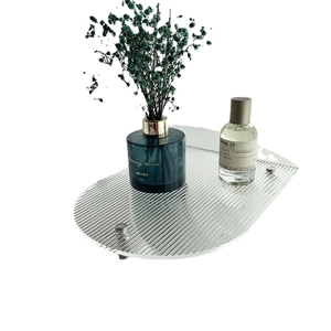 Nordic oval acrylic tray with transparent vertical ridges and silver metal legs