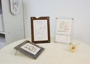 Modern acrylic frame set with clear and amber panels using stylish metal screw fixings