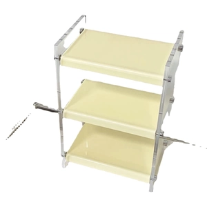 Three-tier acrylic cosmetics organizer shelf for perfume and skincare on white background