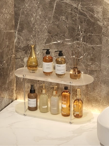 Detail of a 2-tier acrylic bathroom shelf with fluted glass and silver metal frames