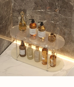 Detail of a 2-tier acrylic vanity shelf with fluted glass texture and silver metal supports