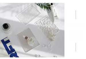 Close-up of clear acrylic photography background boards with water ripples and textures