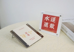 Detail view of colorful acrylic photo frames with metal screw stand and card inserts