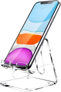 Detailed view of clear acrylic phone stand with non-slip pads and charging port access