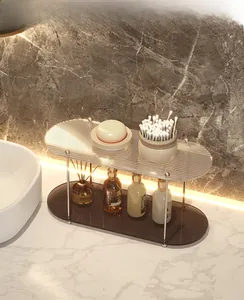 Detail of 2-tier acrylic bathroom organizer with fluted glass and silver metal frame