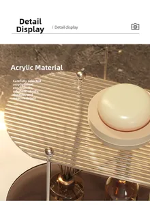 Detail display of transparent acrylic bathroom organizer with elegant metallic supports
