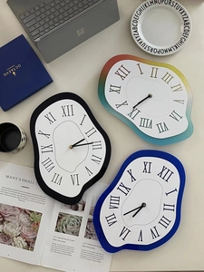 Macro detail of melting Dali style wall clock with Roman numerals in a home office setup