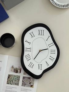 Macro detail of surrealist melting clock with roman numerals in a modern home setting