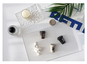 Mini resin coffee cup figurines on acrylic water ripple board for modern home decor