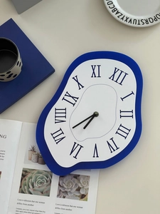 Macro detail of the melting Dali-style wall clock with Roman numerals and blue frame