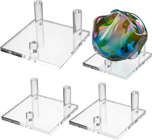 Detailed view of acrylic three-peg display stands for minerals and crystal spheres
