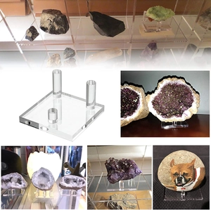 Three-peg acrylic display stand showcasing mineral specimens and crystals in a clear view