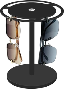 Detail of 360-degree rotating black sunglasses display stand with four pairs of glasses