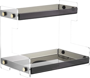 Detail of 2-tier acrylic organizer with gold hardware and smoky grey storage trays