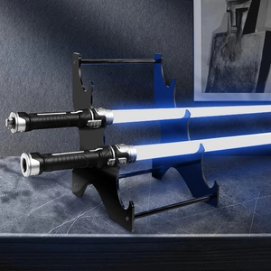 Three-tier black acrylic display stand holding lightsabers on a marble surface