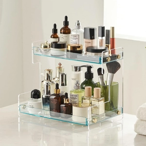 Detail of 2-tier acrylic shelf with metal screws for organizing cosmetics and perfumes
