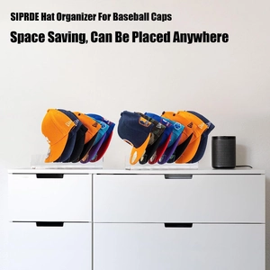 Space-saving acrylic baseball cap organizer set showing multi-hat storage on a white cabinet
