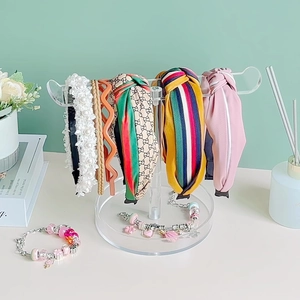 Transparent acrylic headband storage rack with assorted stylish fashion hair accessories
