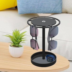 Detail of 360-degree rotating acrylic sunglasses organizer stand in a living room setting