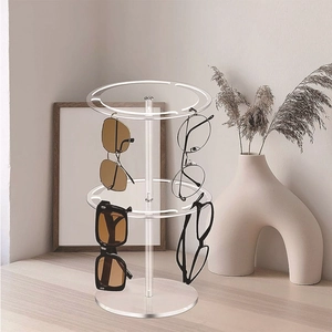 Rotating 2-tier clear acrylic sunglasses display stand showing multiple pairs of glasses