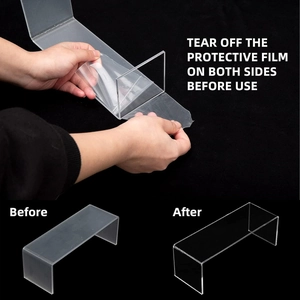 Detail of transparent acrylic U-shaped stand showing protective film removal on both sides