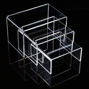 6-piece set of clear acrylic display risers for jewelry and cupcakes in nested U-shape