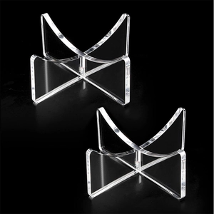 Clear acrylic X-shaped ball display stand for basketballs and footballs on black background